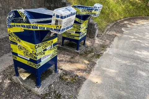 Postal Mail Drop Boxes Taped Shut With Yellow Caution Tape Stock Photos