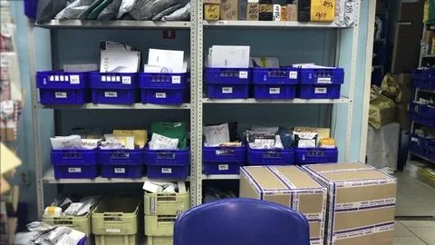 Postal parcels at the post office Stock Footage 83484603