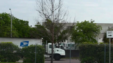 Postal semi truck pulling in to post office Stock Footage 36598252
