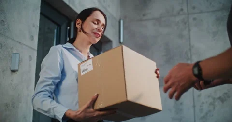 Postal Service Worker Bringing Parcel Box for Client. Businesswoman Signing POD Stock Footage 312386757