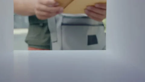 Postal Service Worker Putting Letters into Mailbox Stock Footage 236984259