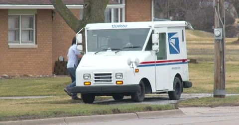 Postal Worker gets in US Mail Truck and drives off - 4k Stock Footage 61135043