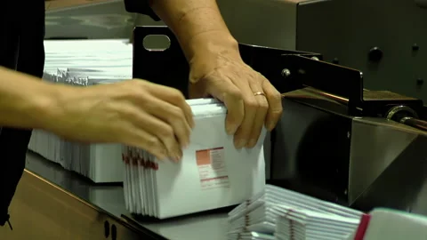 Postal Worker Preparing Mail for Automated Sorting Process - 4K Stock Footage 223380574