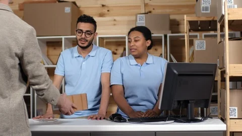 Postal Workers Accepting and Registering Parcel for Shipping 動画素材 114212528