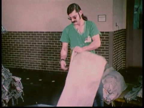 Postal workers and machinery are at work in a mail sorting center and letters Stock Footage 79454285
