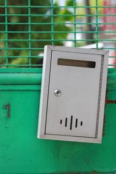 Postbox on door gate Stock-Fotos