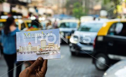 Postcard booklet of Mumbai with blurred city in background Stock Photos