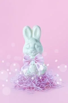 Postcard with Easter bunny on pink background, toned. Stock Photos