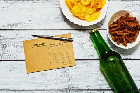 Postcard messaging in bar in flatlay Stock Photos