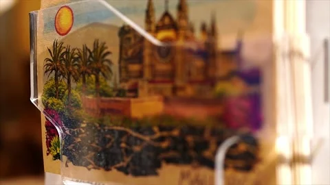 Postcard rack, hand drawn postcards of Mallorca, Spain Stock Footage 192010572