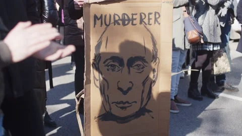 Poster Banner With The Image Of Putin Murderer. Protest Against The Russian War Stock Footage 171107804