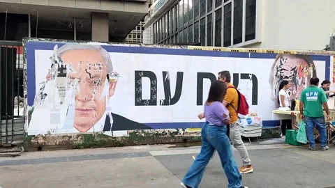 Poster of Benjamin Netanyahu and Jair Bolsonaro are damaged in Sao Paulo, Br... Stock Footage 277528376