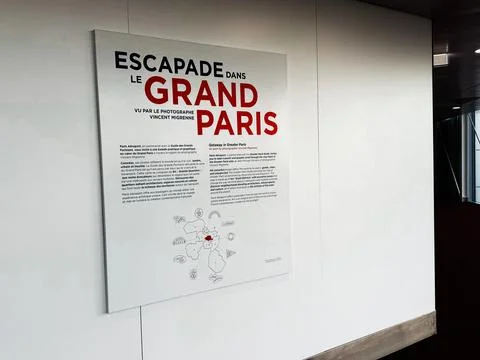 Poster display for Escapade dans le Grand Paris exhibition in Paris, France.. Stockfoto's