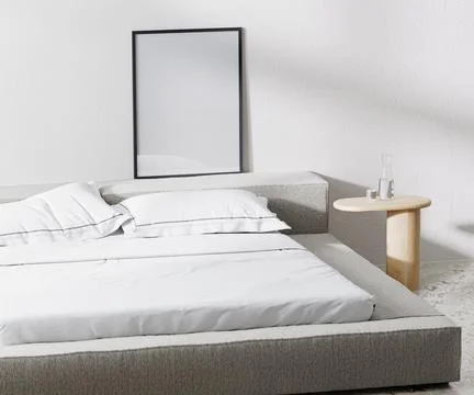 Poster frame in room with bed and pillows and bedside table with white wall o Stock Illustration