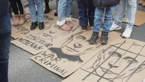 Poster With The Image Of Putin Lying On The Street - Trampling Allowed Stock Footage 171108056