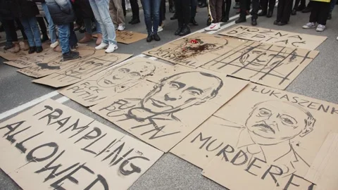 Poster With The Image Of Putin Lying On The Street - Trampling Allowed Stock Footage 171108088