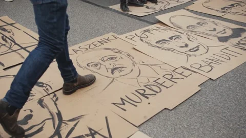 Poster With The Image Of Putin Lying On The Street - Trampling Allowed. Stock Footage 171108193
