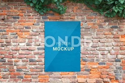 Poster mockup attached to brick wall. Blank paper for print add presentation moc PSD Template