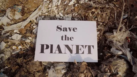 Poster save the planet on the background of trash Stock Footage 127248655