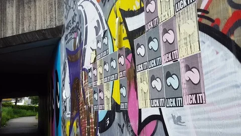 Posters and graffitis on a wall Stock Footage 76003237