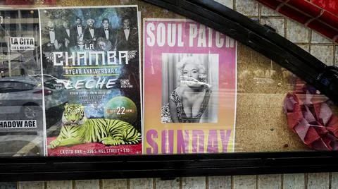 Posters in window Stock Photos