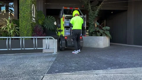 Postie delivering mails and parcels in the latest battery-operated Stock Footage 223490909