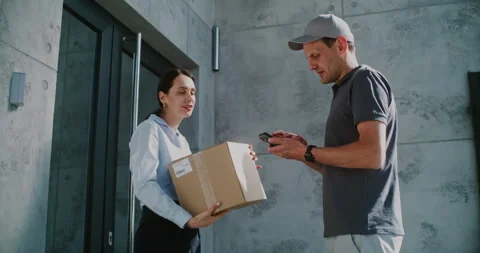 Postman Coming to Modern Office Building, Delivering Parcel Box for Recipient Stock Footage 312384055