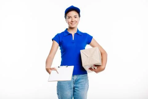 Postman delivers parcel to the client smiling. Stock Photos