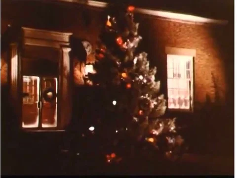 A postman sorts mail at the Post Office for Christmas delivery in the 1980s. Stock Footage 75082902