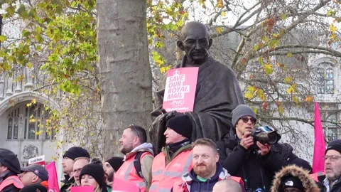 Postmen protest at Parliament square in front of Mahatma Gandhi statue Stock-Footage 225910392