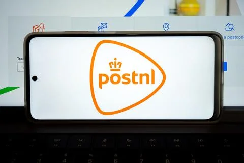 Postnl logo displaying on a mobile phone Stock Photos