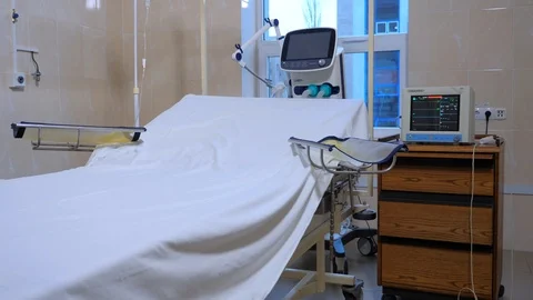 Postoperative ward in the clinic. White sheet on the hospital bed in empty room Stock Footage 104885590