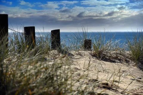 Posts on a pathway leading to the beach Stock Photos