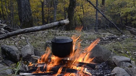 Pot above bonfire Stock Footage 104080431