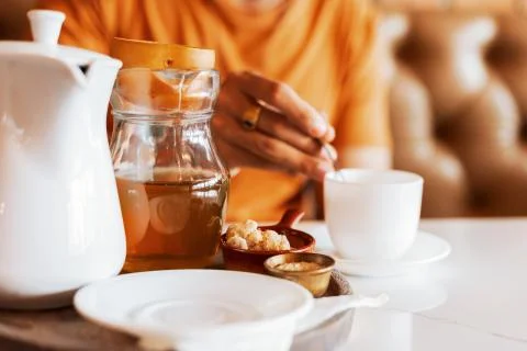 Pot and cup of tea on the table. Stock Photos
