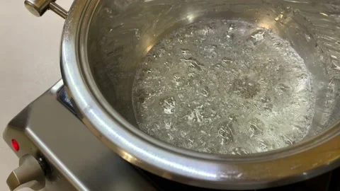 Pot of boiling Bubbles of syrup. Preparing caramel. Stock Footage 160568867