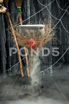 A pot of boiling potion on a dark background, no people Stock Photos
