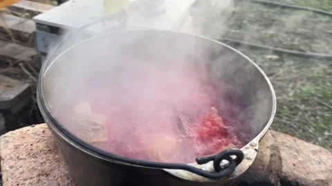 A pot of boiling soup outside Stock Footage 240252985