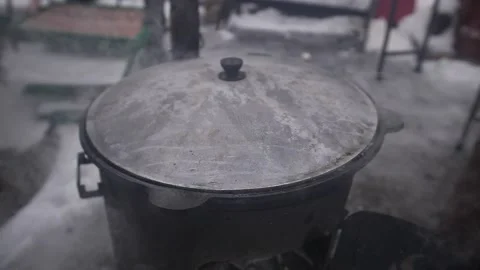 A pot of boiling water on a fire in the open air. Stock-Footage 229556643