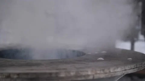 A pot of boiling water on a fire in the open air. Stock Footage 229556647