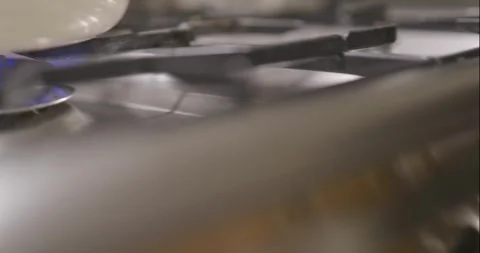Pot On Burner Hand Changes Knob Pan Diagonal Up Left Stock Footage 261902212