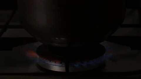 A pot on a burning gas stove Stock Footage 201490877