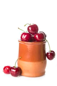 Pot with cherries isolated on a white background Stock Photos