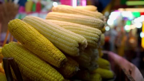 Pot of cooked corn ready for sale at a traditional fair Stock Footage 295449936