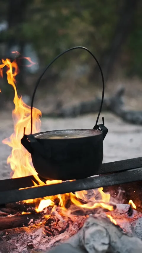 Pot Cooking over Campfire - Vertical Stock Footage 284769487