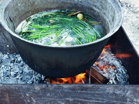 Pot on the fire, close up Stock Photos
