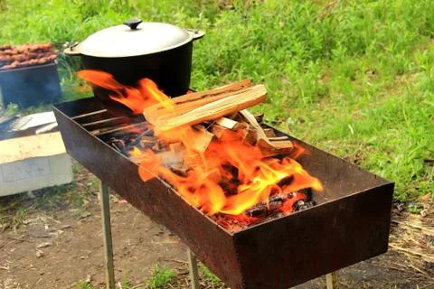Pot on the fire grill 스톡 사진