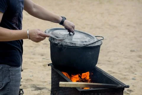 In the pot on the fire preparing food. Stock Photos