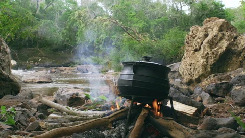 Pot on Fire by the River Stock Footage 132753334