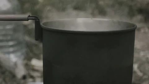 A pot on a fire, the water is boiling Stock Footage 139048912